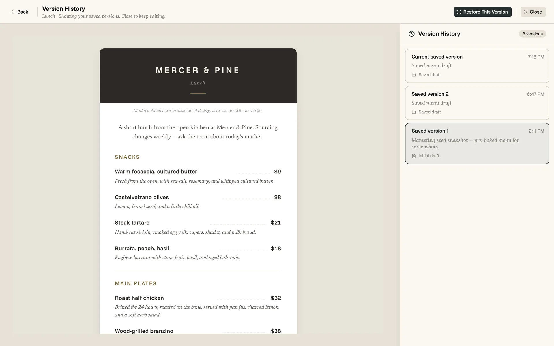 Carte editor's Version History panel showing multiple saved versions with timestamps and a 'Restore This Version' button