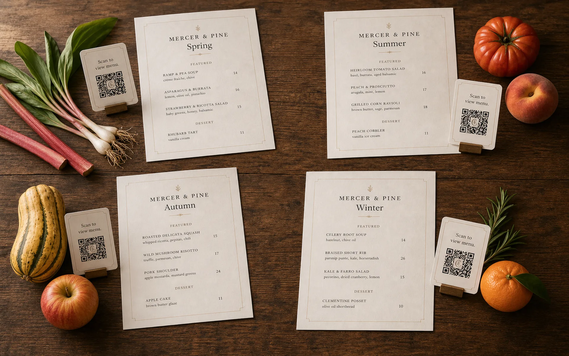 Four printed Mercer & Pine menu editions in a 2×2 grid on warm wood — Spring, Summer, Autumn, Winter — each surrounded by season-specific produce and paired with its own QR card
